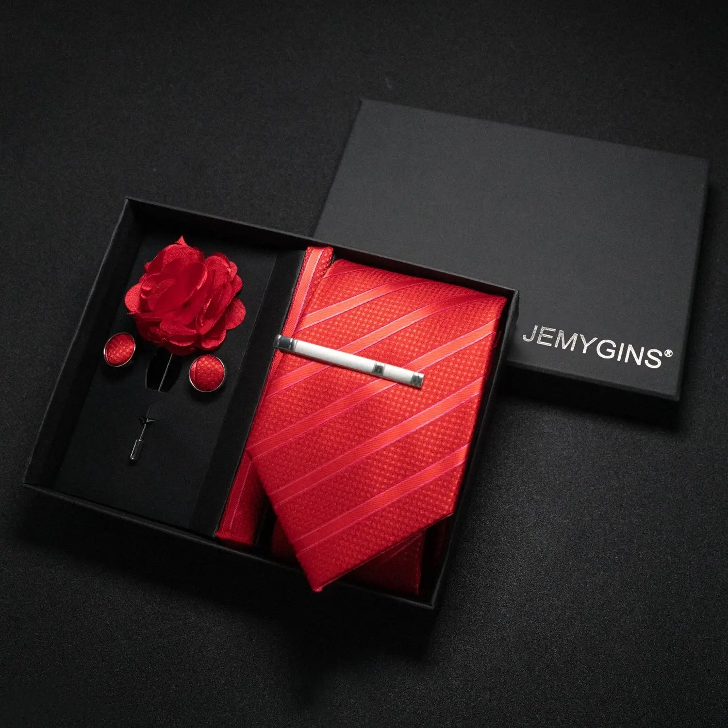 Wine-red paisley tie set with a sophisticated presentation.