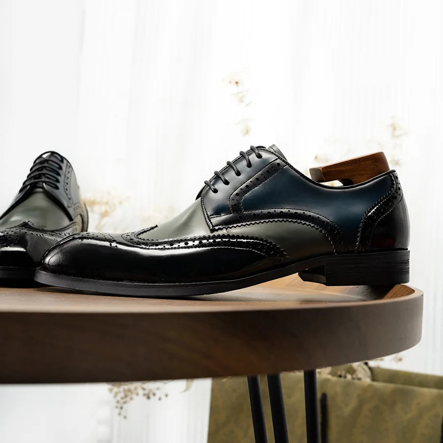 Men's formal leather dress shoes featuring classic pointed toe design and traditional lace-up closure