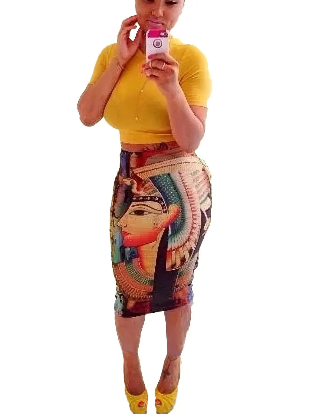 Model wearing knee-length summer outfit, radiating confidence with bold patterns and flattering fit.