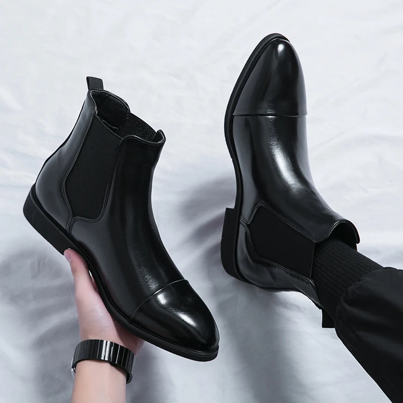 Side profile of classic-fit slip-on boots in timeless black leather
