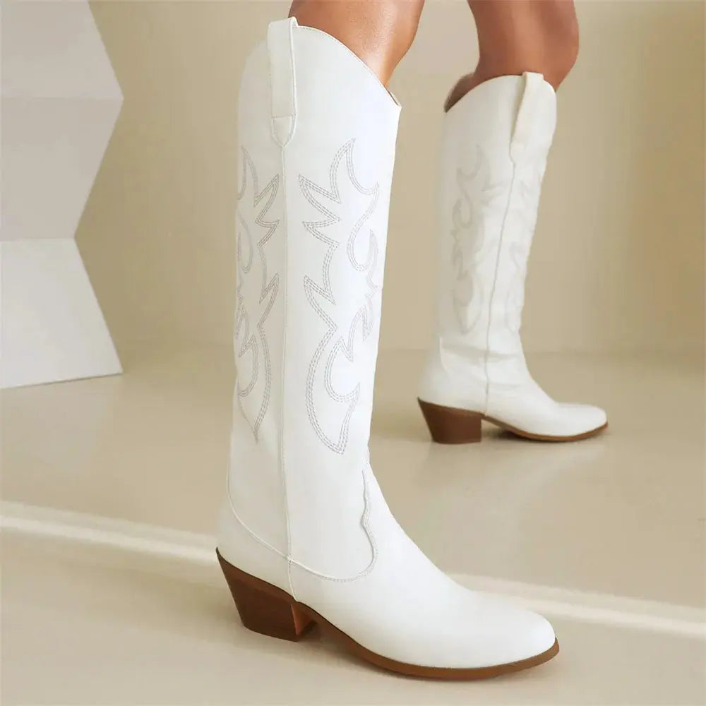 Detailed embroidered pattern on cruelty-free knee-high cowboy boots with comfortable block heel and premium vegan leather
