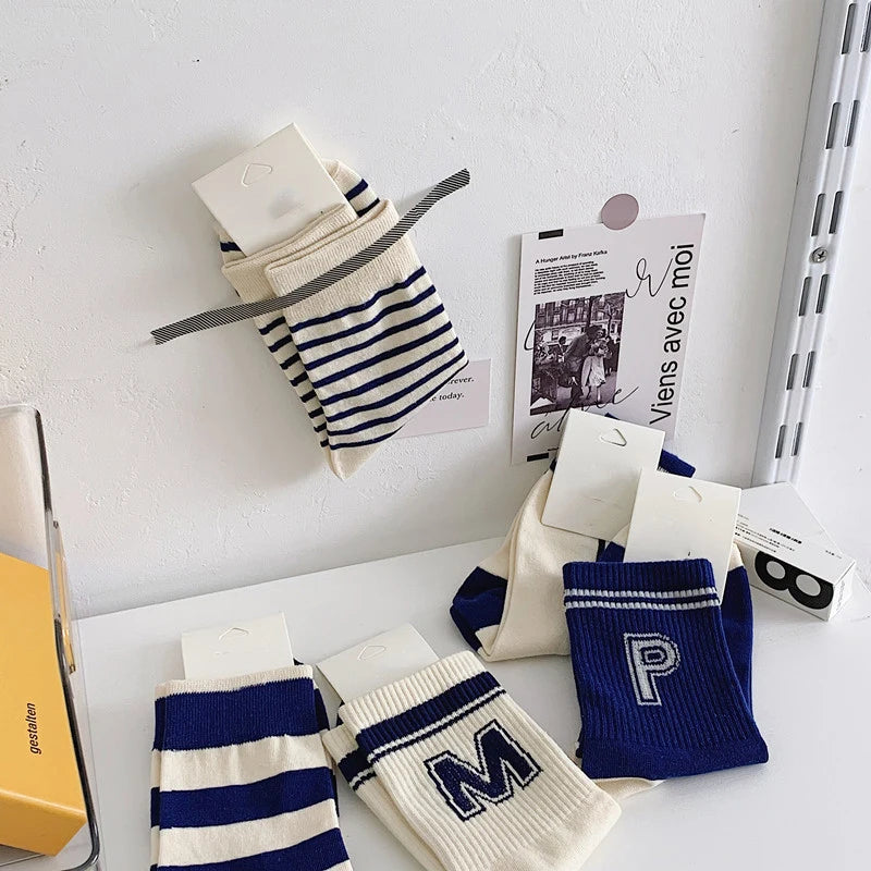 Stylish blue socks featuring classic stripes, suitable for casual and professional settings.