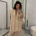 Flat lay of the Dazzle Effortlessly sequin suit set, showcasing its versatile elegance and design.