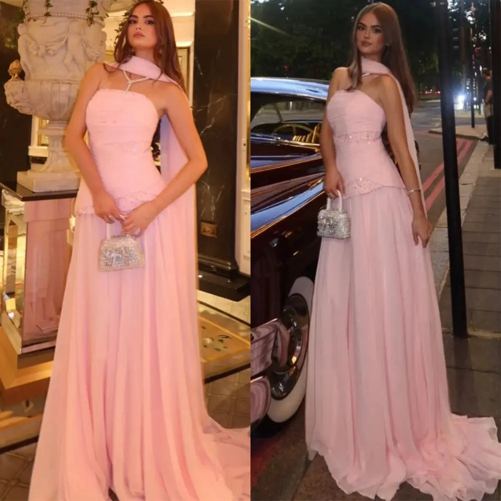 Strapless chiffon evening gown in deep navy with a flowing Watteau train.