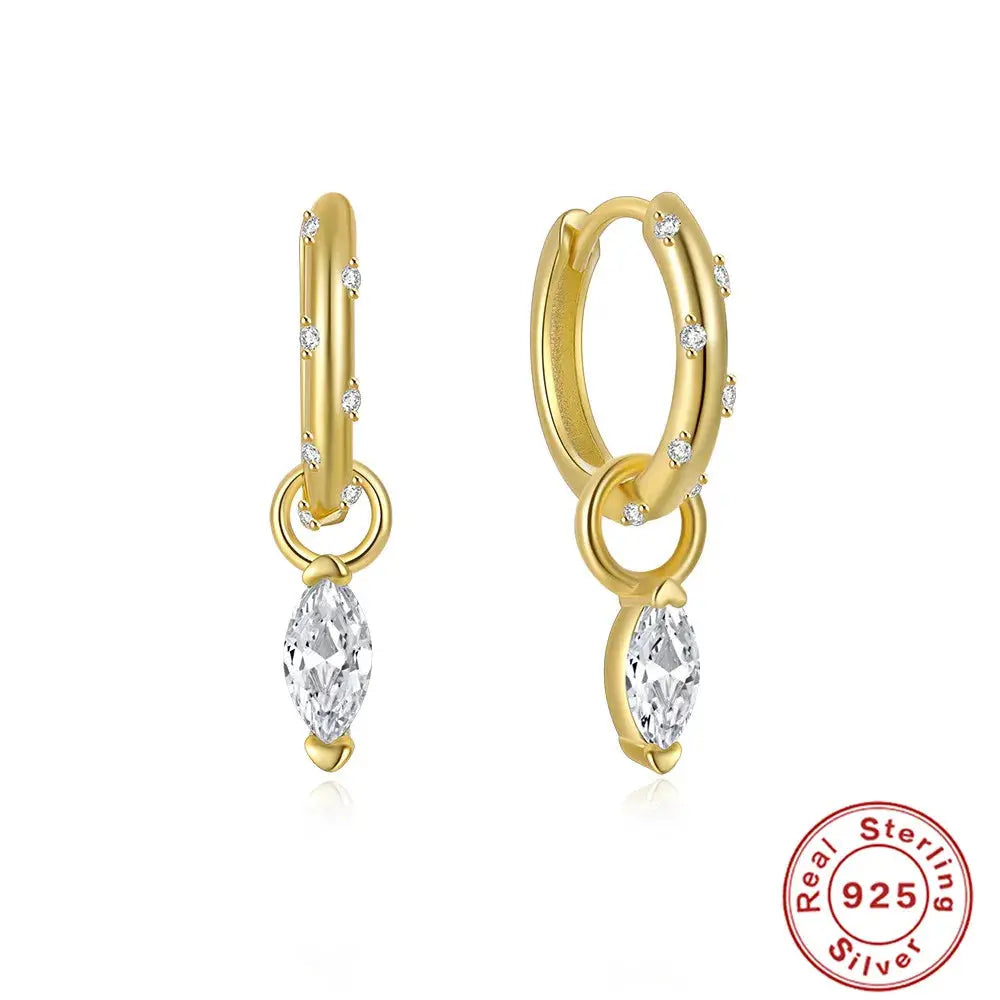 Refined silver drop earrings that catch the light with every movement.