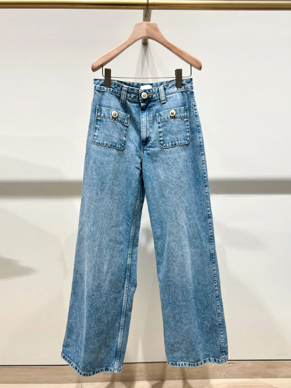 Wide leg blue jeans in breathable denim for effortless chic style.