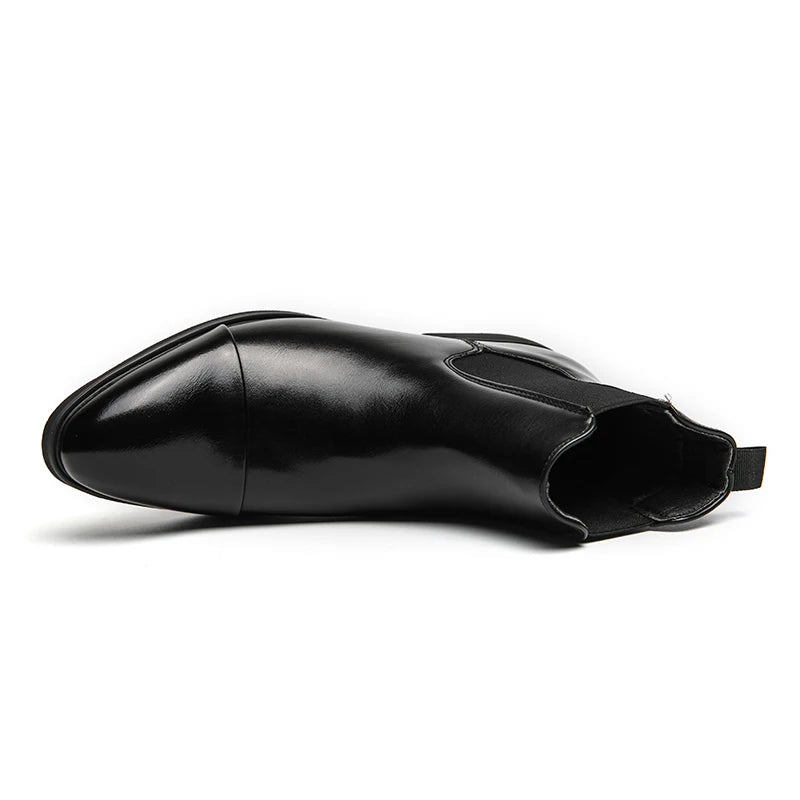 Rear view of sleek ankle boots with pull tab and elastic panels