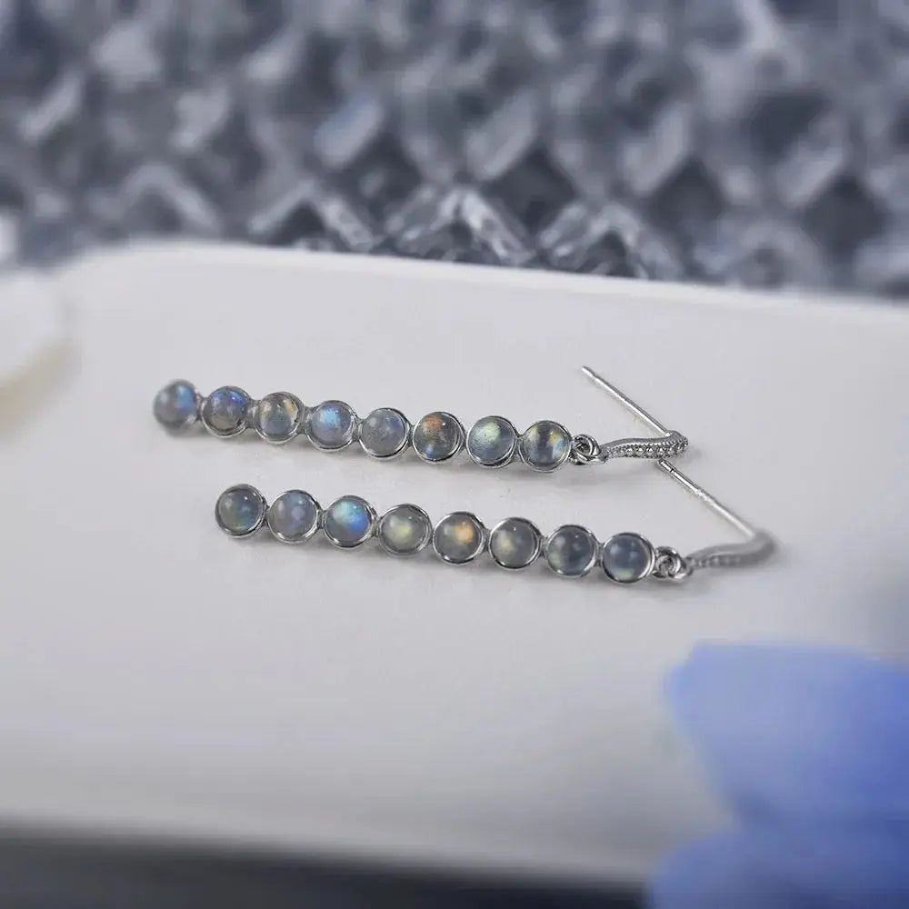 Elegant silver dangle earrings featuring mystical labradorite, perfect for any occasion.