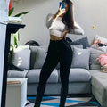 Versatile stretch denim jeans with contemporary ripped design and flattering high-waist construction for women