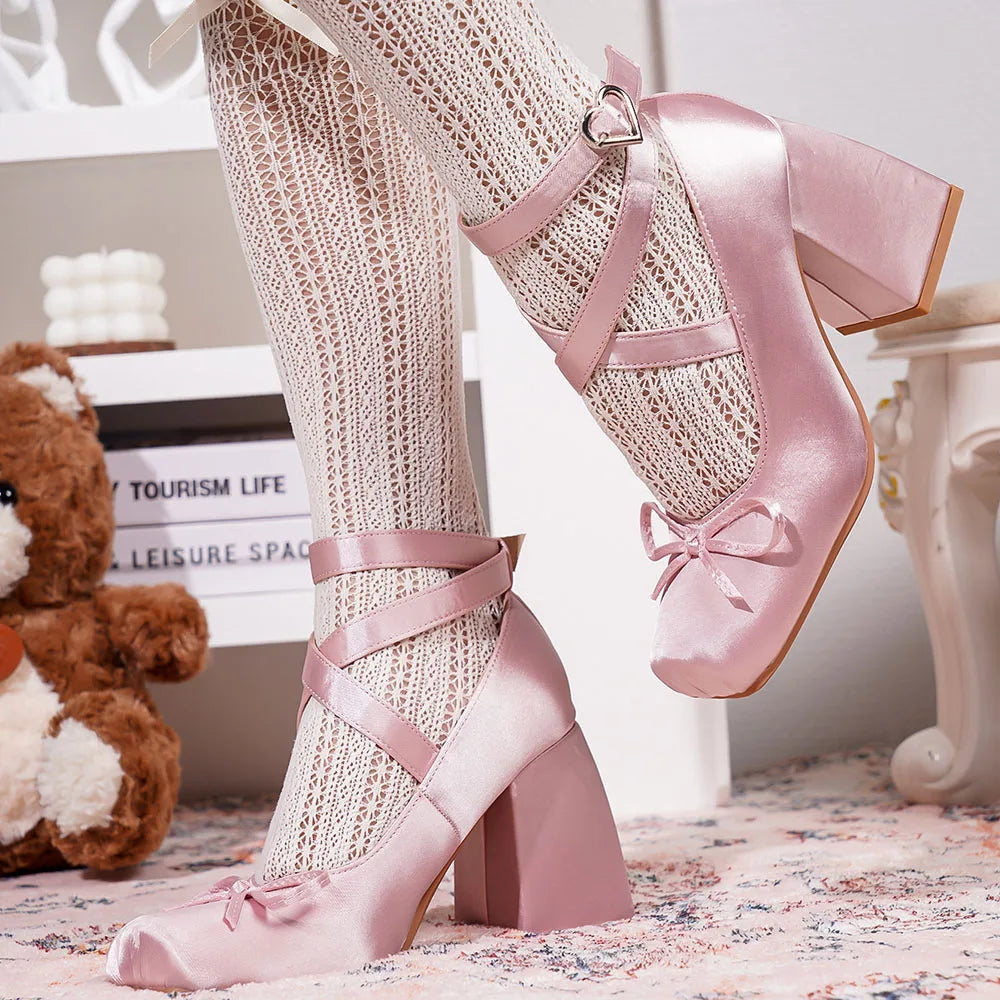 Side view of blush satin heels featuring a robust block heel.
