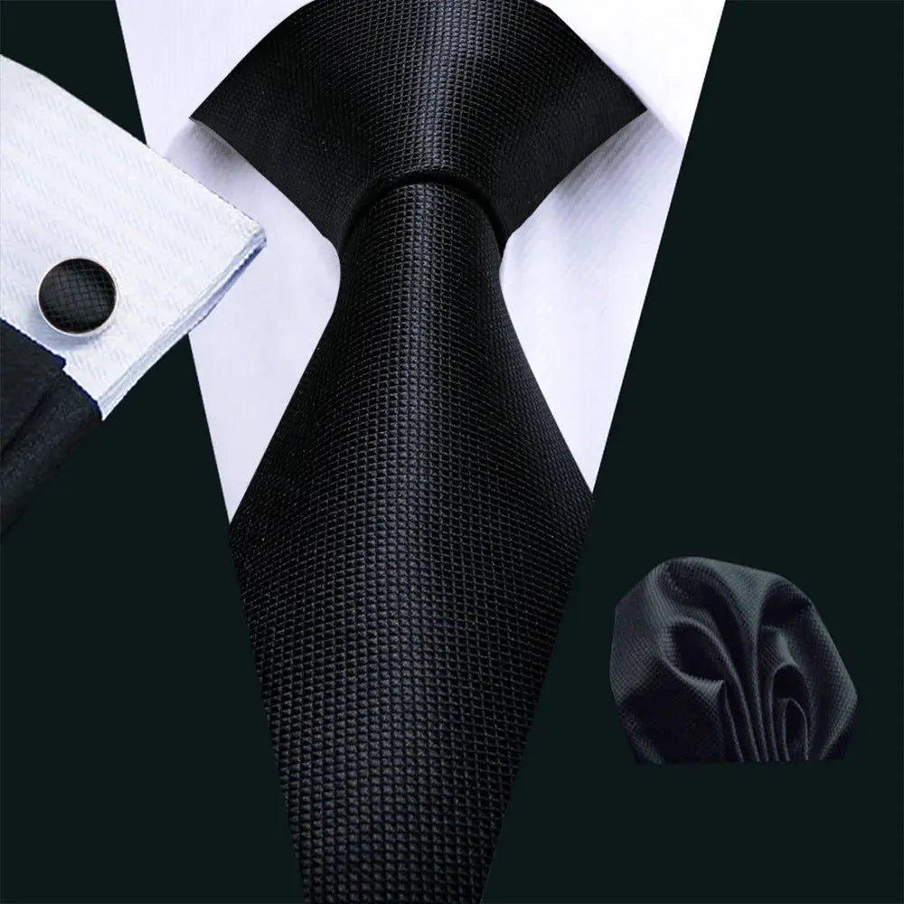Polished black tie and cufflinks set for sophisticated style