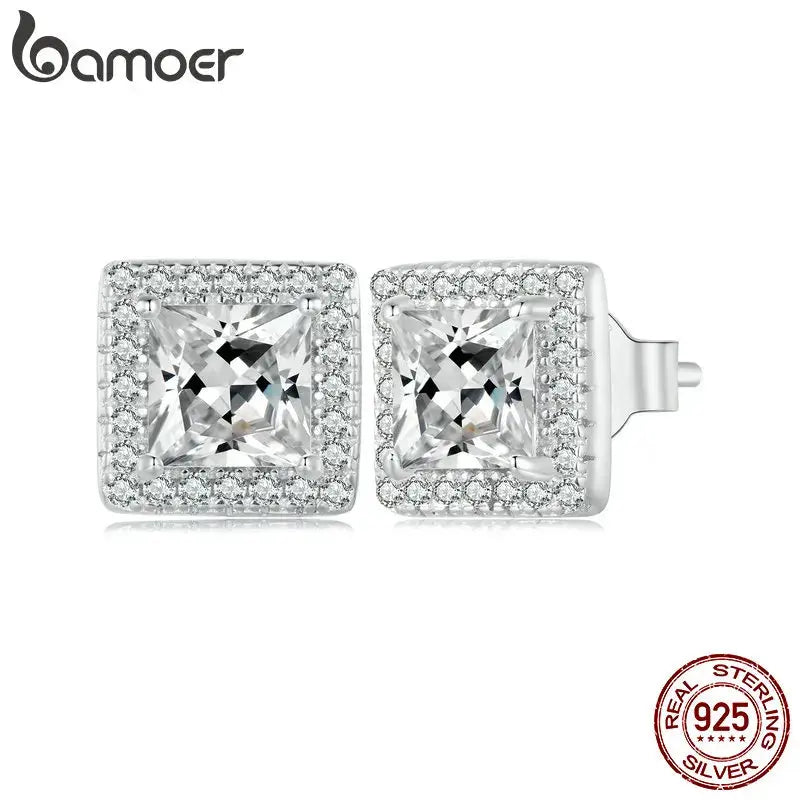 Radiant Halo Studs in 925 sterling silver with central zirconia stone, showcasing brilliant sparkle.