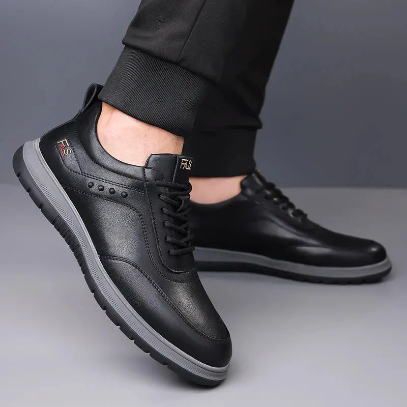 Black split leather Oxford dress shoes with classic lace-up design on white background