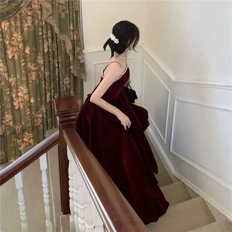 Back view of the Midnight Whisper Velvet Midi Dress, emphasizing the seamless blend of velvet and chiffon.