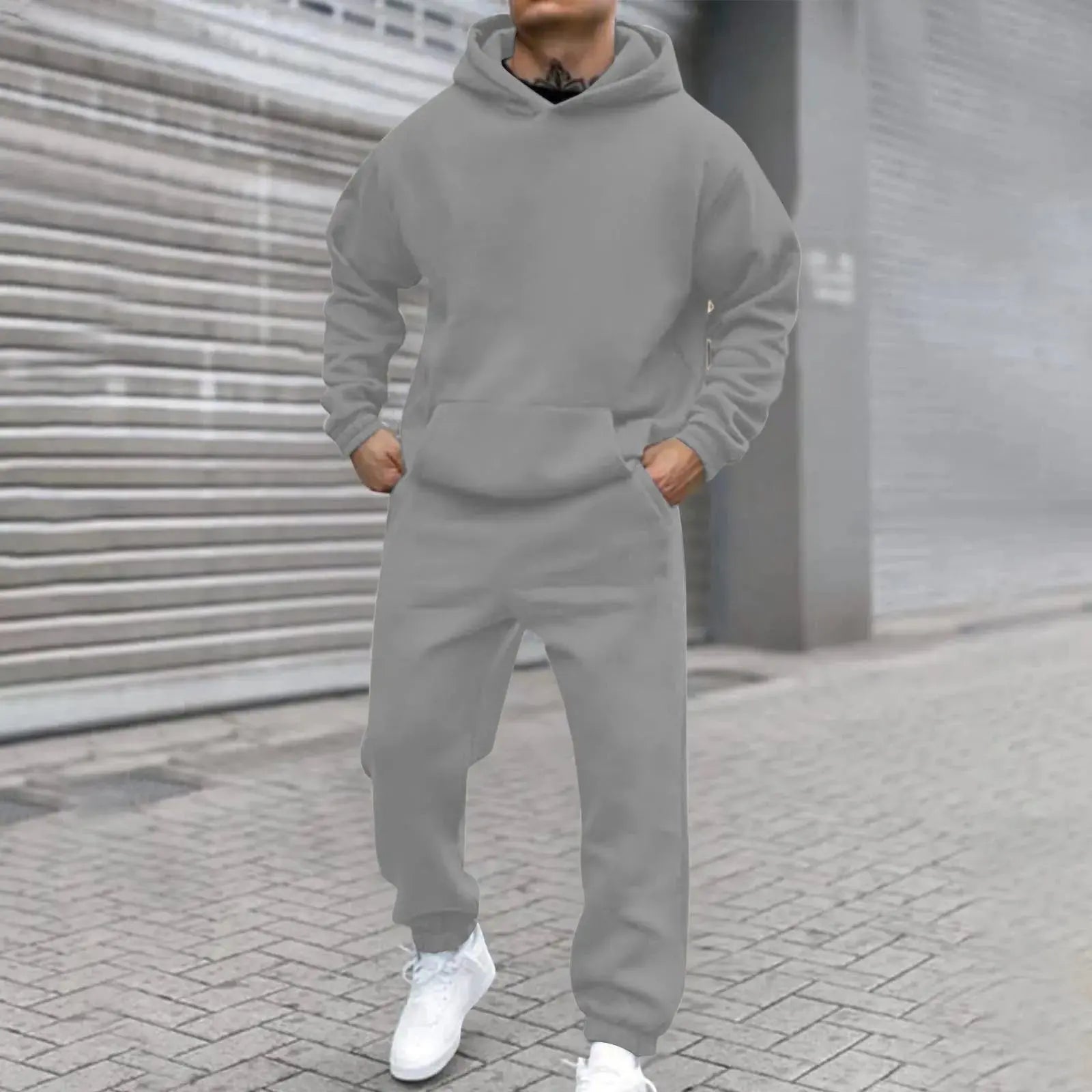 Men's Leisure Suit displayed on model, demonstrating relaxed fit and sleek silhouette.