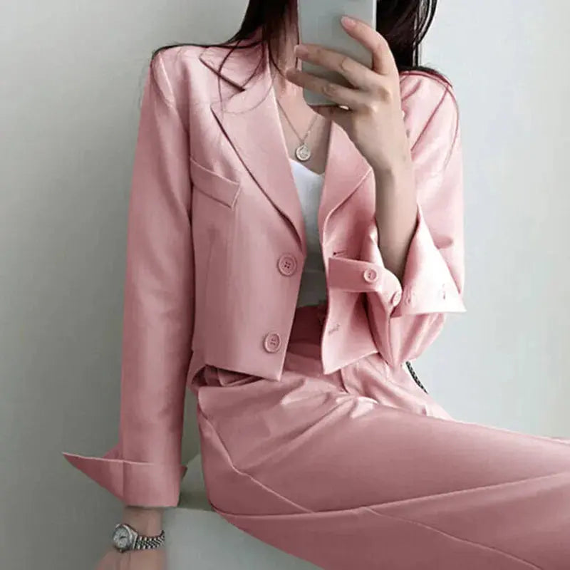 Chic wide-leg power suit in black, featuring a single-breasted blazer and high-rise pants.