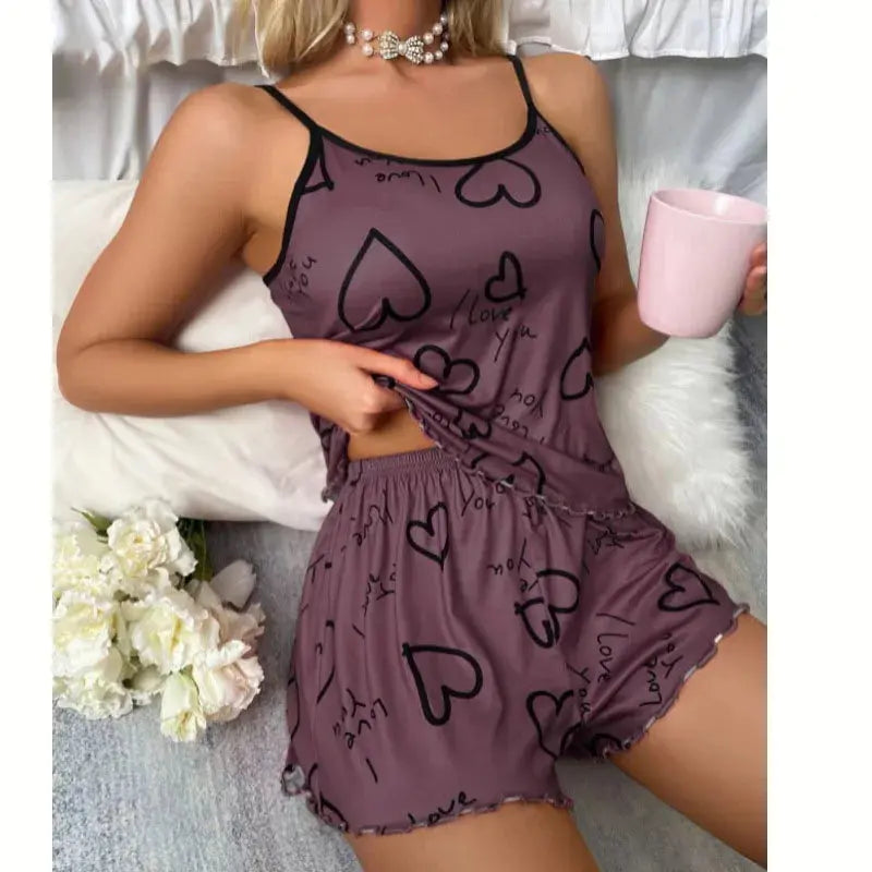 Whisper-Soft Heart Pajamas Set in pastel pink with playful heart print and pleated shorts.