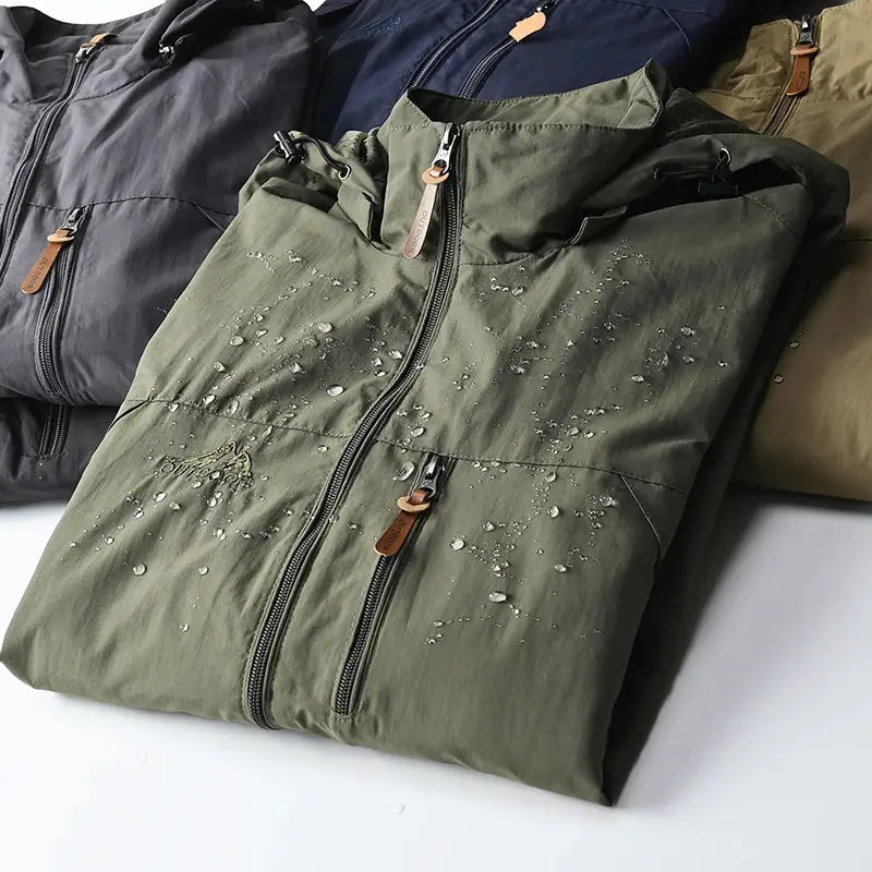 Zipper pocket detail on the tactical windbreaker, ideal for secure storage during outdoor activities.