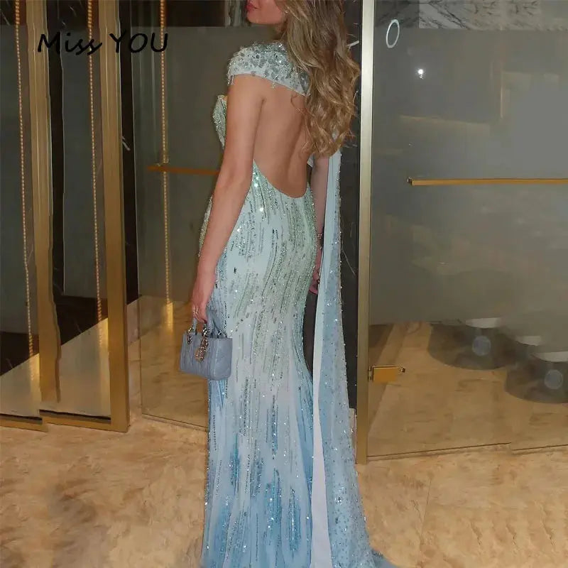 Enchanting blue mermaid gown with shimmering sequins and delicate beading.
