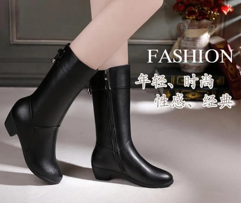 Brown mid-calf boots featuring soft plush lining and elegant leather construction