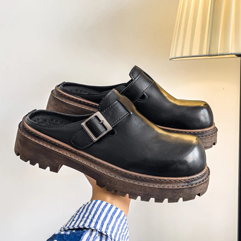 Black leather backless platform mules with metal accent detail for men