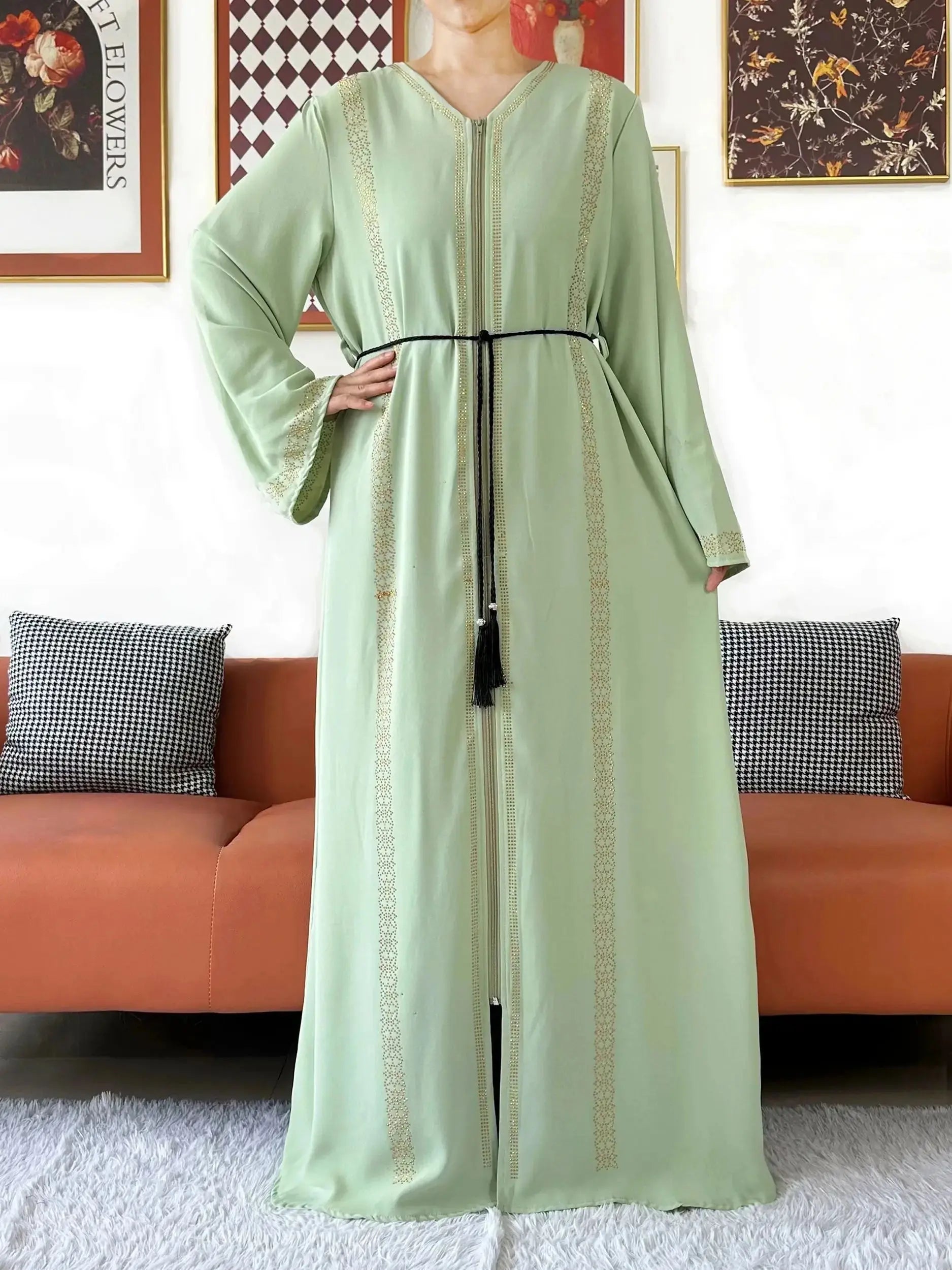 Close-up of shimmering diamonds on the chiffon abaya, adding subtle sparkle.