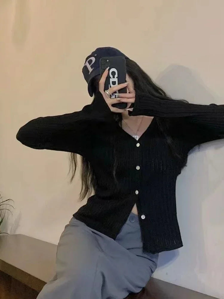 Back view of the Autumn Whisper cardigan highlighting its flattering slim fit and elegant design.