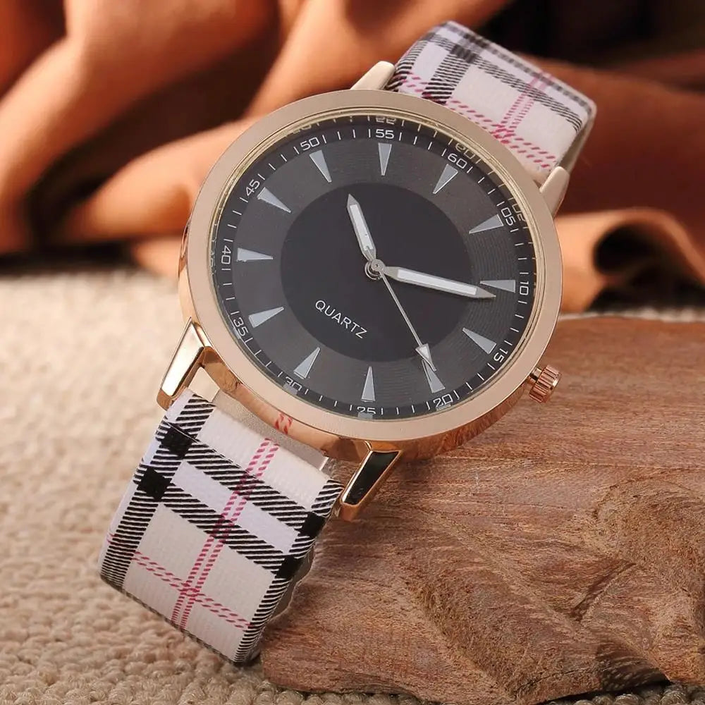 Timeless Touch watch with vintage plaid leather strap and round face.