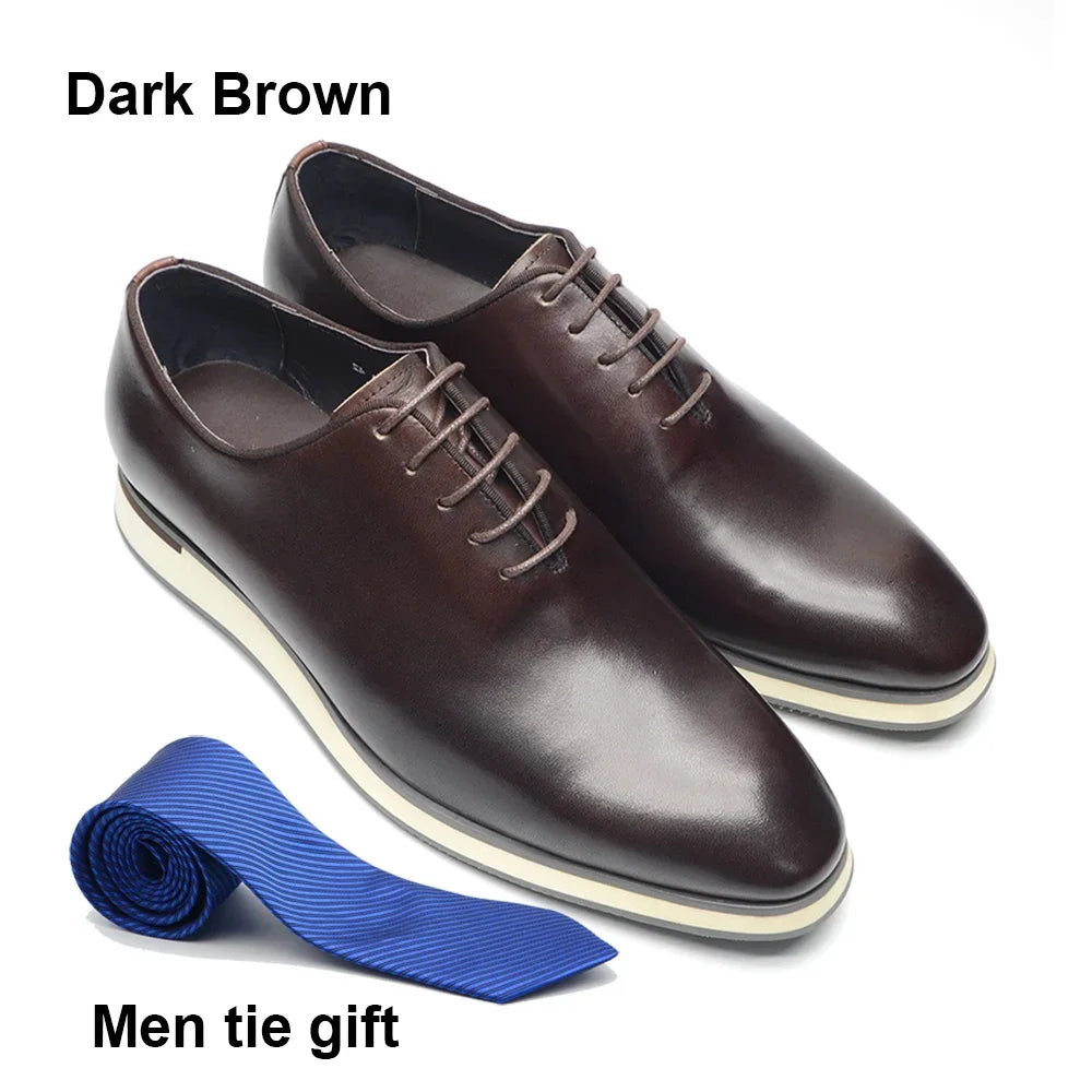 Detail of handmade Oxford dress shoe construction showing seamless single-piece cowhide leather craftsmanship