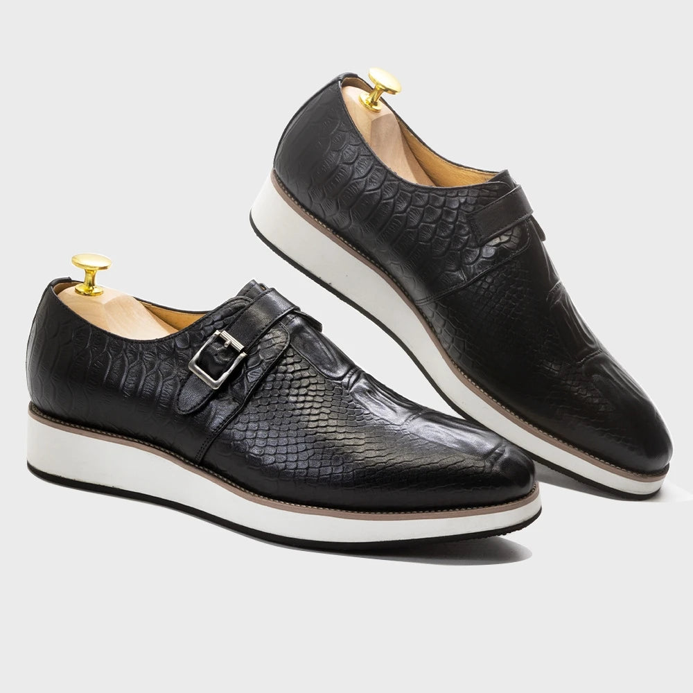 Side view of handcrafted monk strap shoes showing crocodile leather texture and adjustable buckle fit