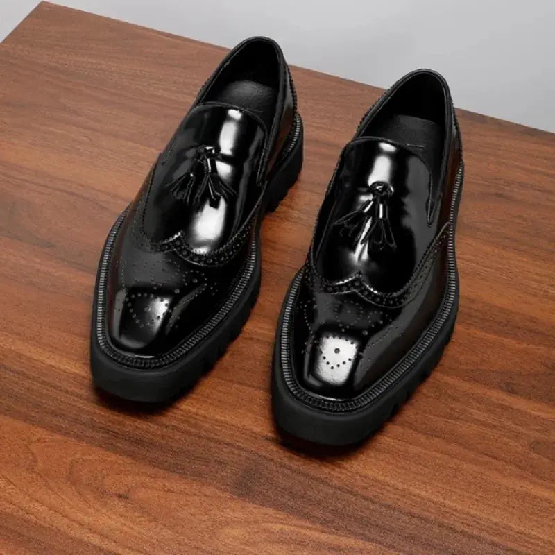 Stylish black tassel loafers showcasing classic sophistication.