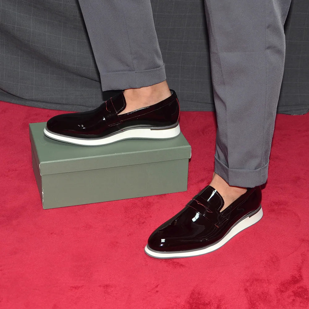 Boardroom-ready loafers showing sleek profile and elevated heel