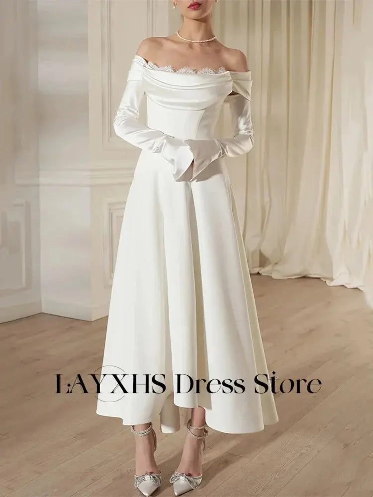 Enchanting Aisle Moment wedding dress in lace and tulle, featuring off-the-shoulder design.