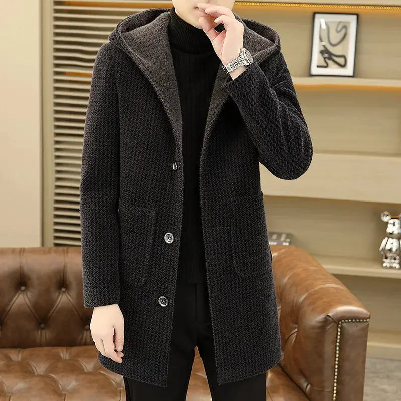 Elegant men's overcoat displayed on a mannequin, showcasing its modern silhouette.