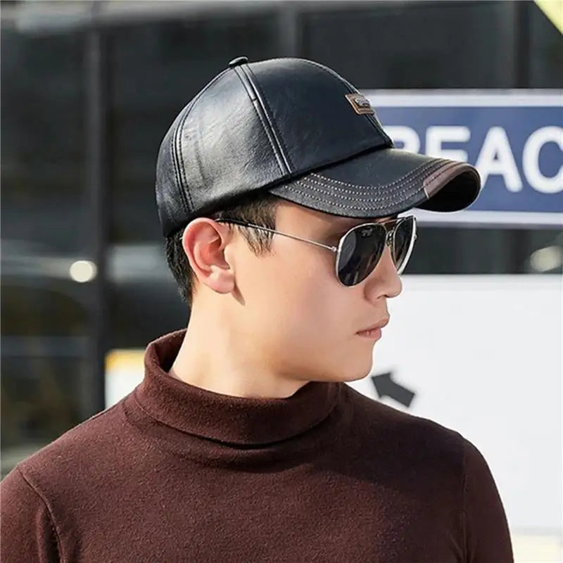 Men's winter cap in premium faux leather, perfect for autumn fashion.