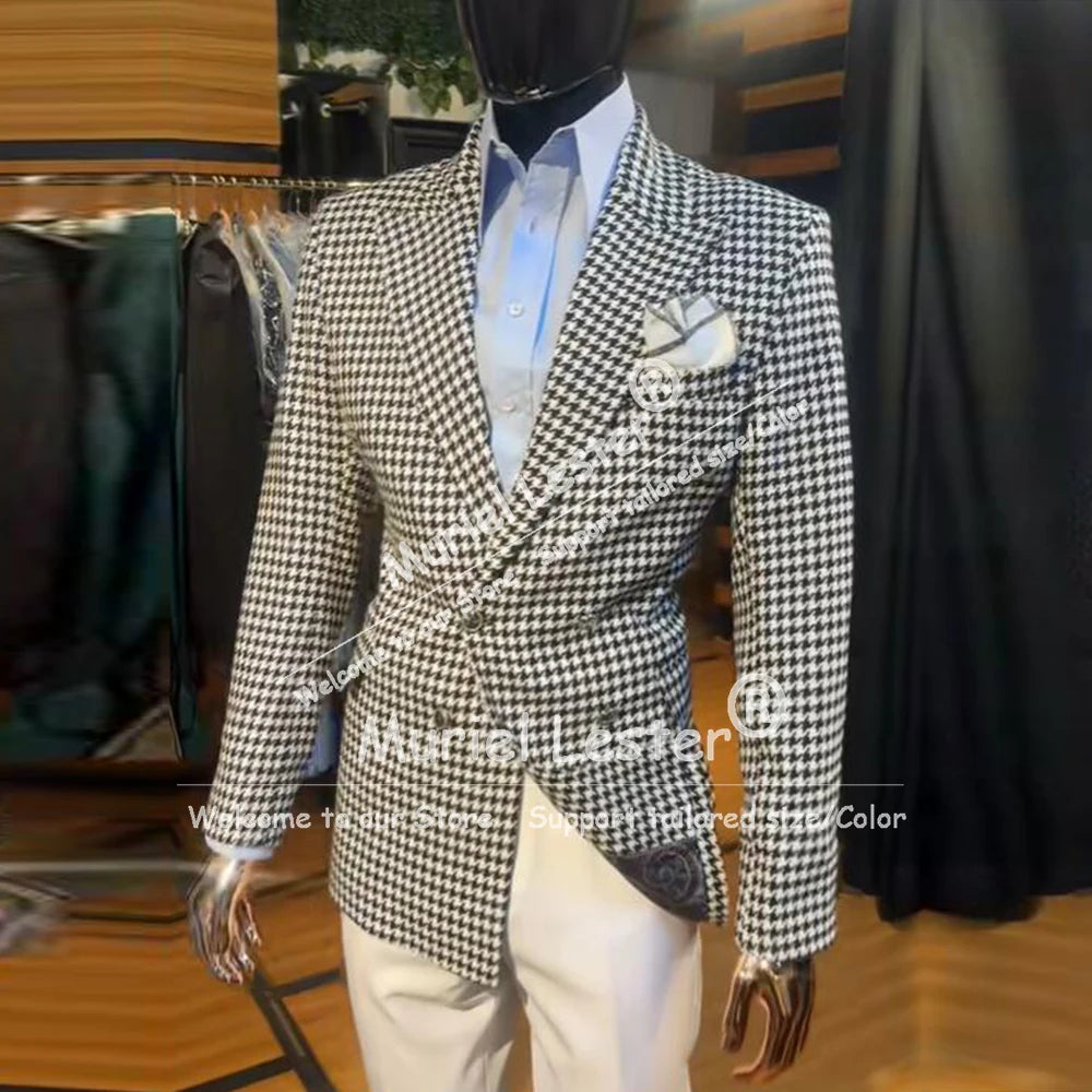 Tailored houndstooth suit ensemble in classic black and white, showcasing refined British style.