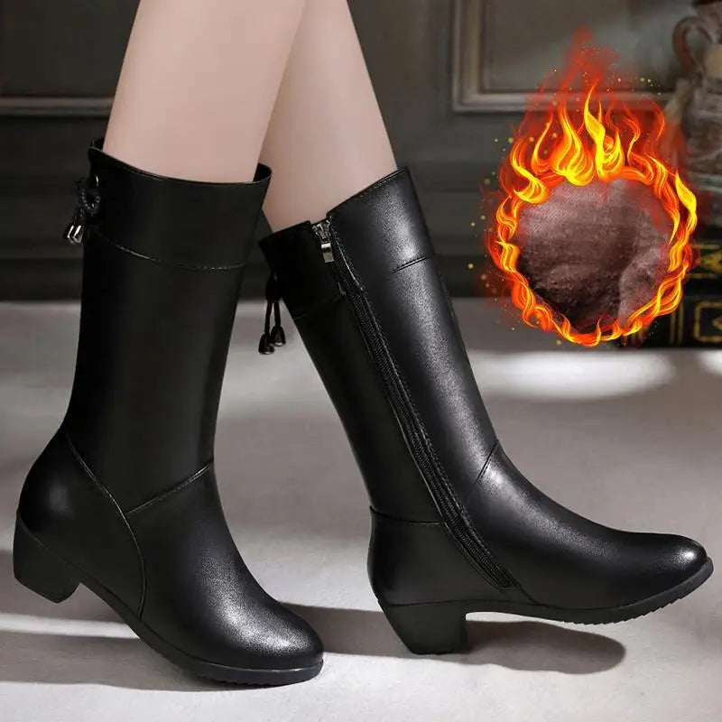 Elegant leather winter boots with mid-calf height and convenient zipper closure