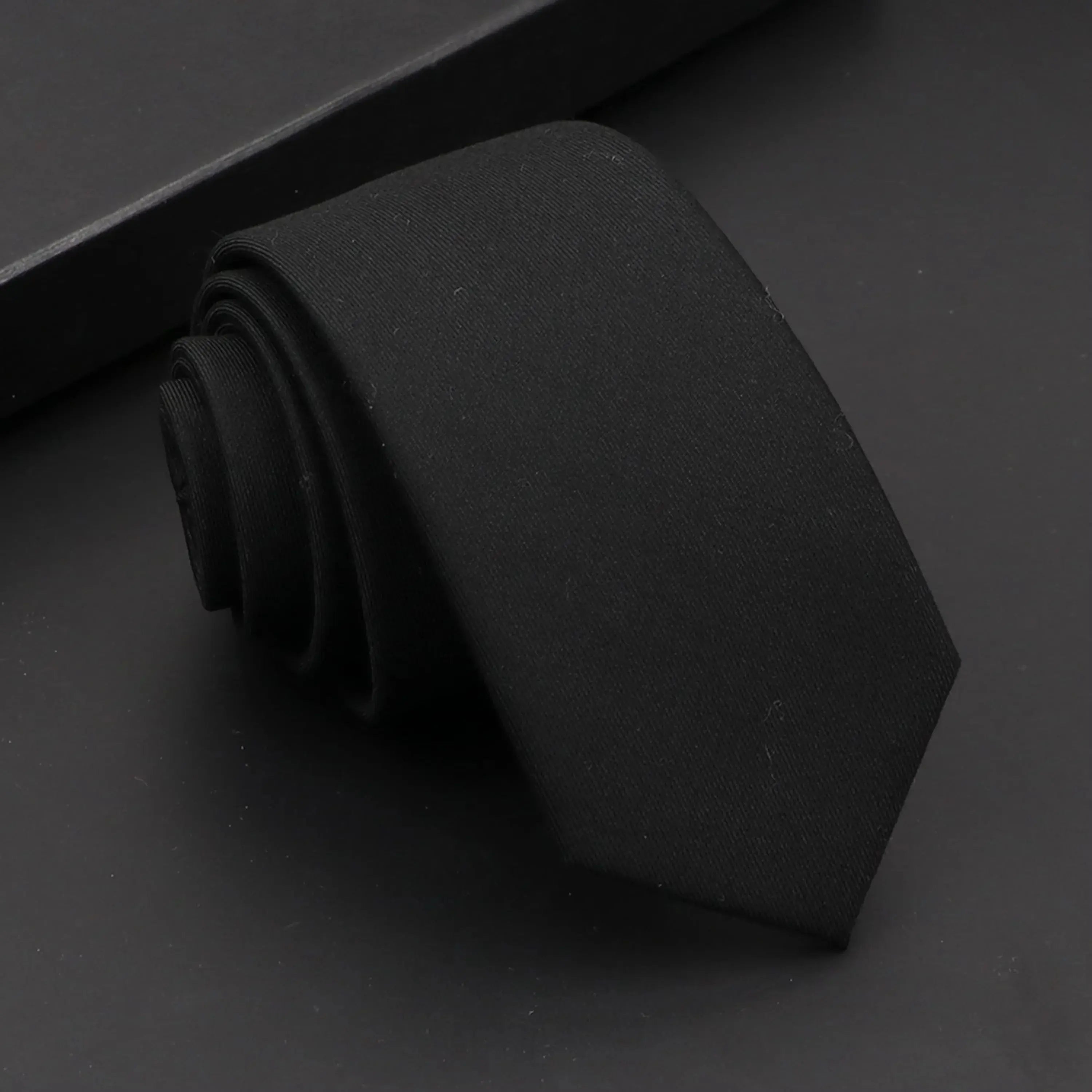 Luxury black tie crafted from high-quality cotton for a sophisticated appearance.