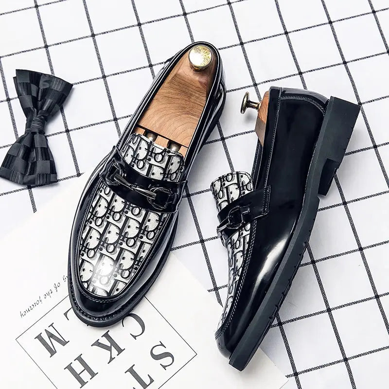 Sleek graphic loafers in black PU with pointed toe design for modern professionals.