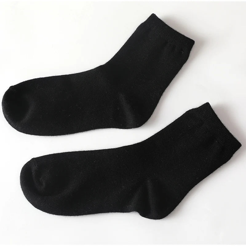 Cashmere socks styled with winter boots, showcasing their fashionable and functional design.
