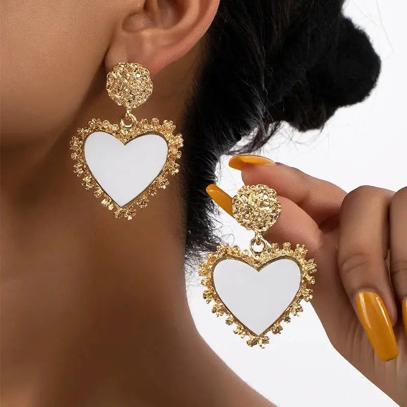 Heartfelt Whispers Dangle Earrings, a romantic accessory that adds sparkle and charm to evening wear.