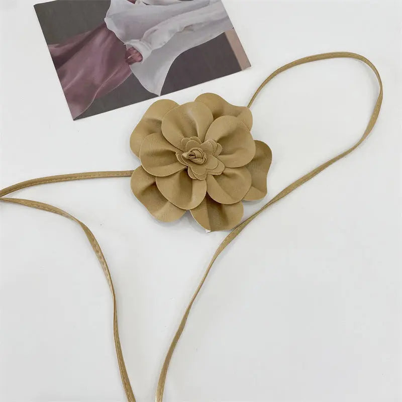 Elegant floral design on a no buckle PU belt, ideal for dresses and blouses.