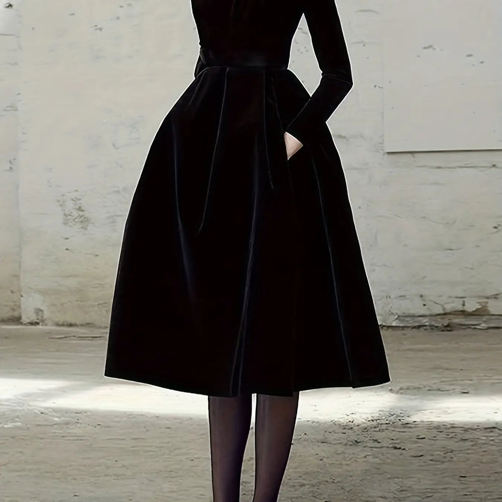 Model wearing the Midnight Whispers Gown, highlighting its sophisticated design and statement footwear.