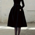 Model wearing the Midnight Whispers Gown, highlighting its sophisticated design and statement footwear.