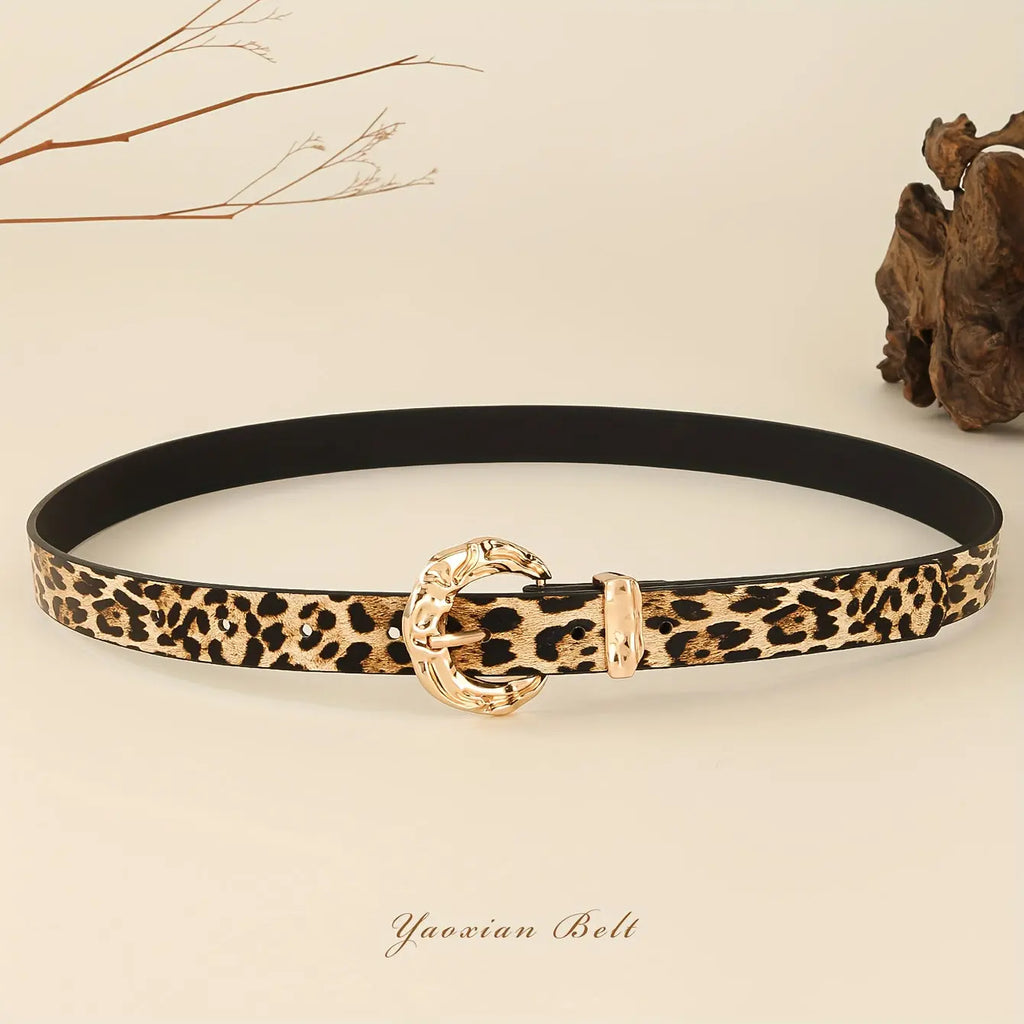 Close-up of the Golden Whispers Belt showcasing its luxurious faux leather and vintage charm.