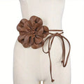 Cinch your silhouette with this stylish no buckle floral belt.