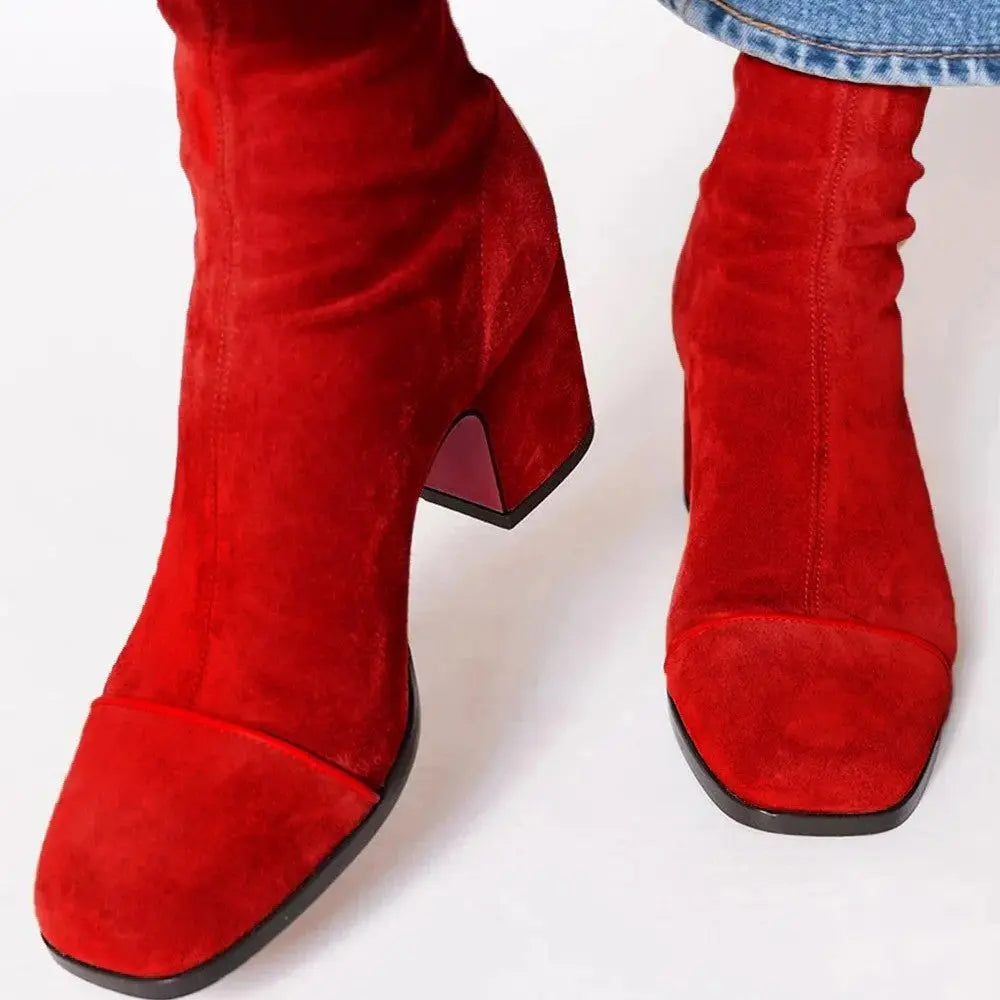 Elegant white square-toe boots with a sleek silhouette, perfect for day-to-night transitions.