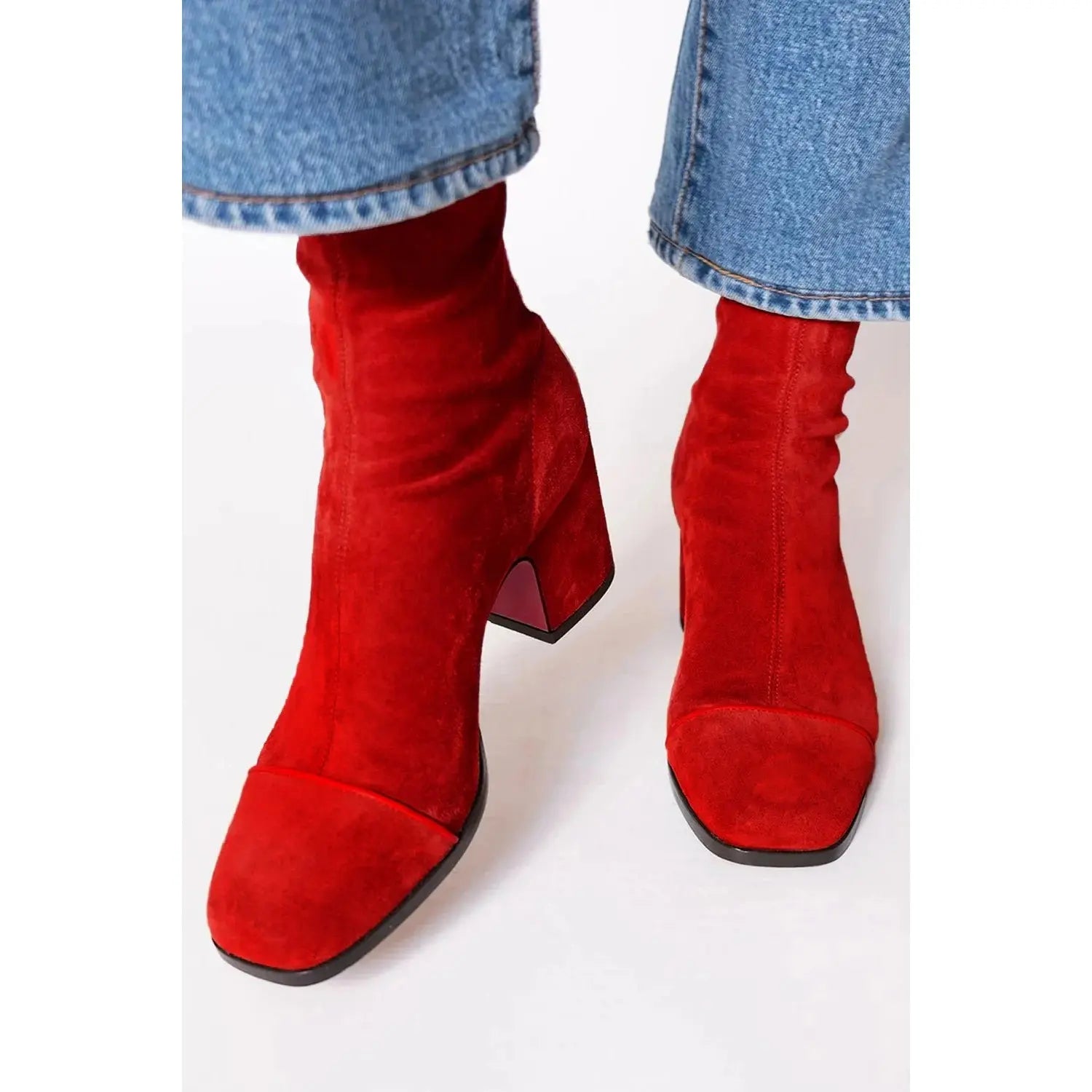 Chic black square-toe ankle boots with mid-height block heel and zipper closure.