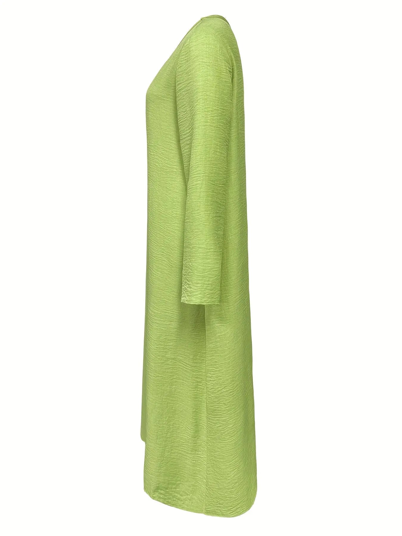 Model twirling in the Whisper-Soft Olive Dress, demonstrating its graceful A-line silhouette.