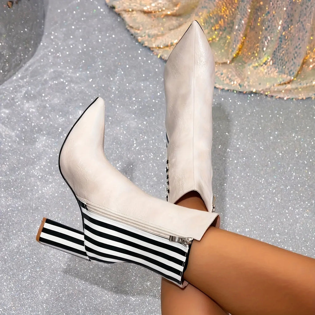 Versatile black boots perfect for casual or dressy outfits with a sleek silhouette.